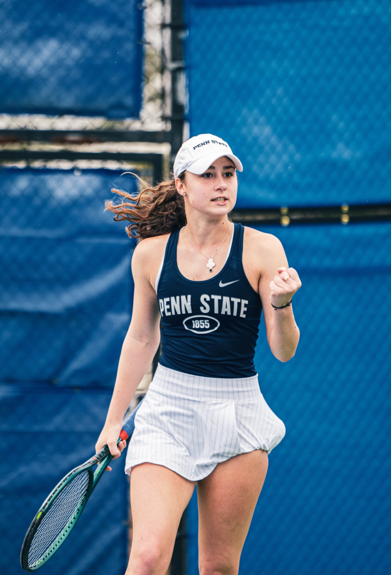 Penn State tennis player celebrating mid-match